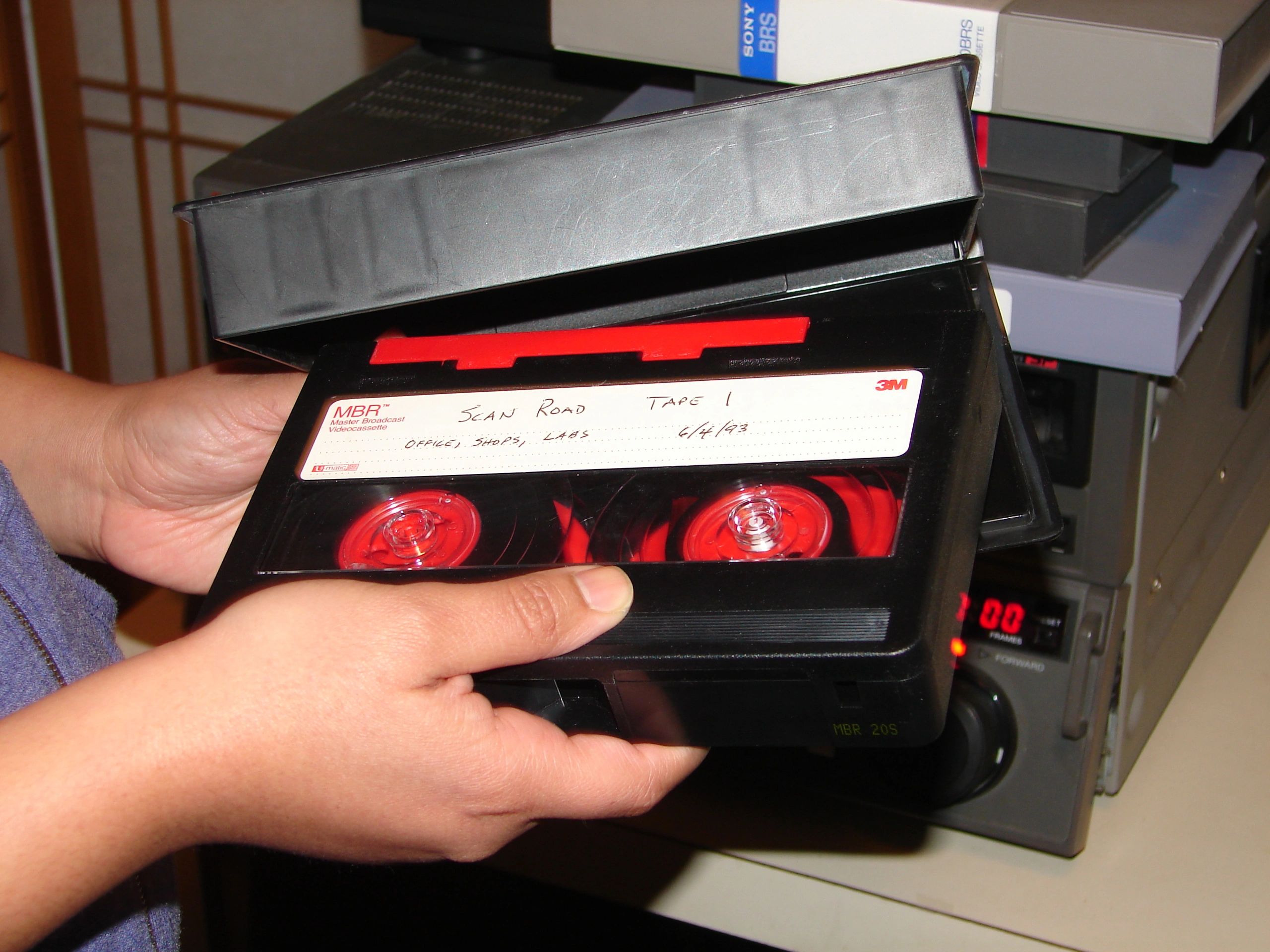 Hand holding VHS tape
